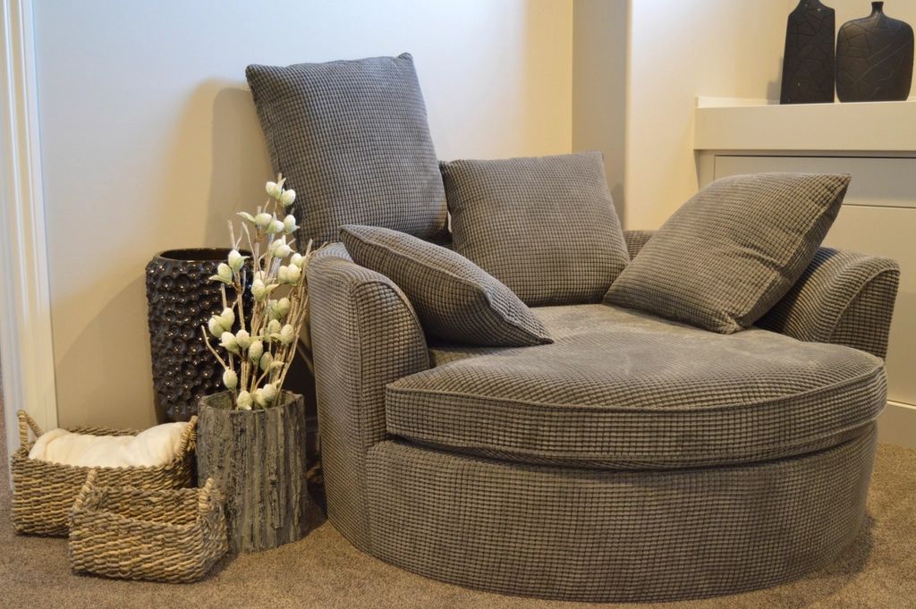A suite sitting room with a sofa and armchairs